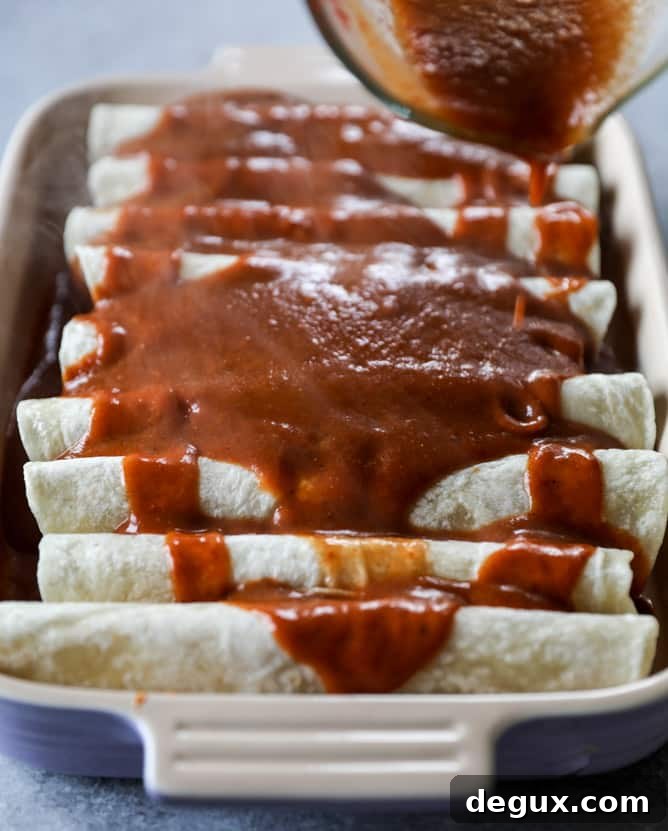 Smoky Enchilada Sauce in 10 Minutes with Cheesy Pork Enchiladas 3 cheesy pork enchiladas with 10 minutes smoky enchilada sauce I howsweeteats.com