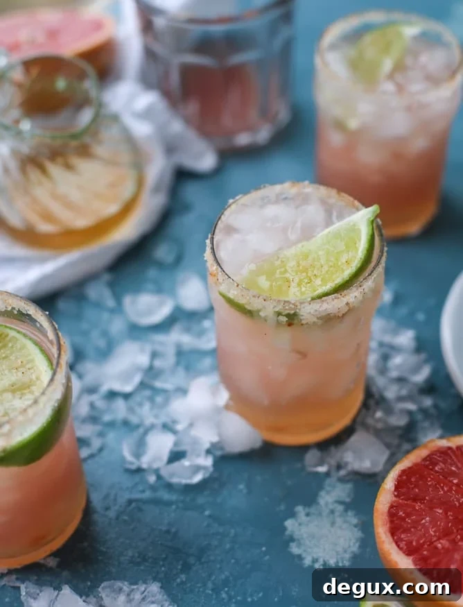 Spicy Chili Salt Pink Grapefruit Margarita Recipe 2 pink grapefruit margaritas with chili salt I howsweeteats.com