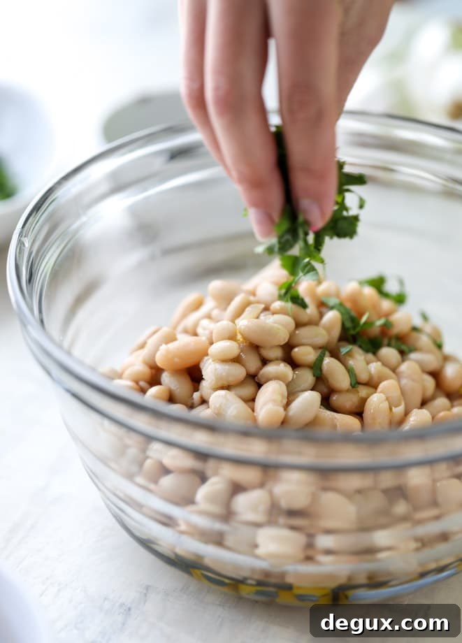Marinated White Beans on Olive Oil Toast: Savory Brunch Recipe 4 marinated white beans with olive oil toasts I howsweeteats.com
