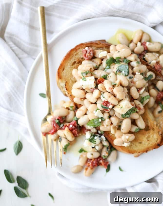 Marinated White Beans on Olive Oil Toast: Savory Brunch Recipe 7 marinated white beans with olive oil toasts I howsweeteats.com