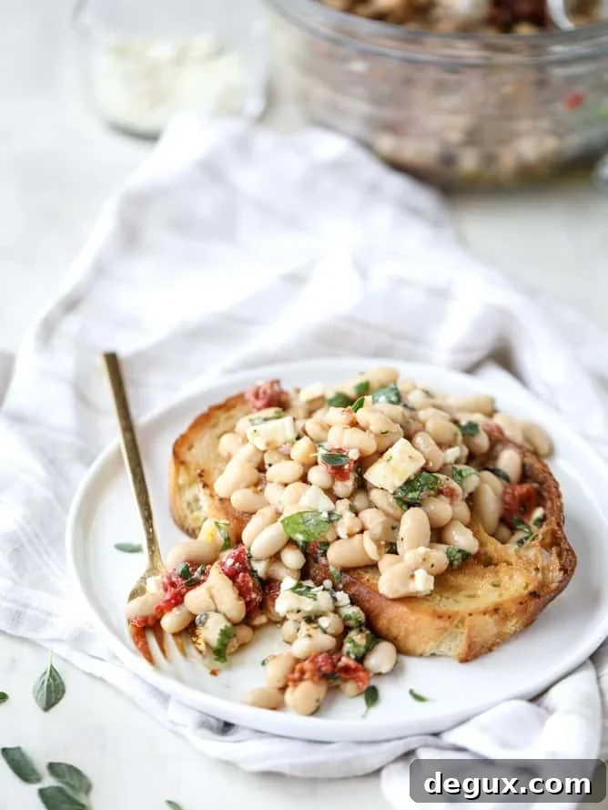 Marinated White Beans on Olive Oil Toast: Savory Brunch Recipe 9 marinated white beans with olive oil toasts I howsweeteats.com