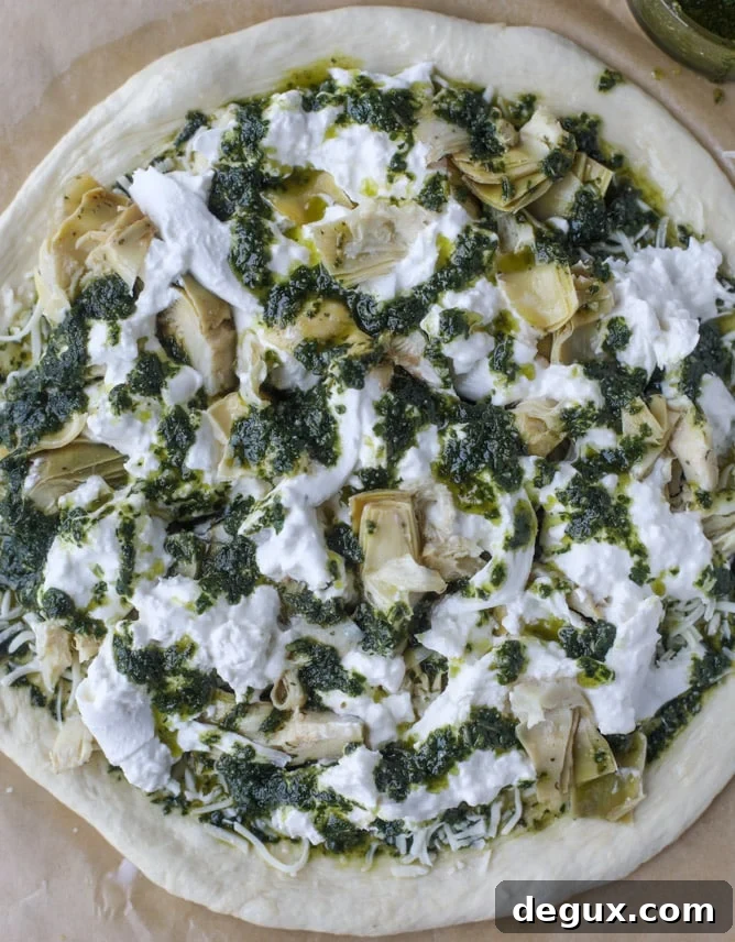 Artichoke Burrata Pizza with Lemon-Basil Pesto Recipe 4 artichoke burrata pizza with lemon basil pesto I howsweeteats.com