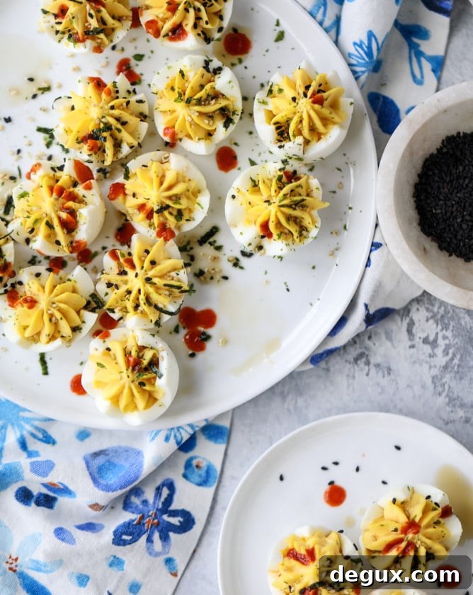 Toasted Sesame Sriracha Deviled Eggs Recipe 11 toasted sesame sriracha deviled eggs I howsweeteats.com