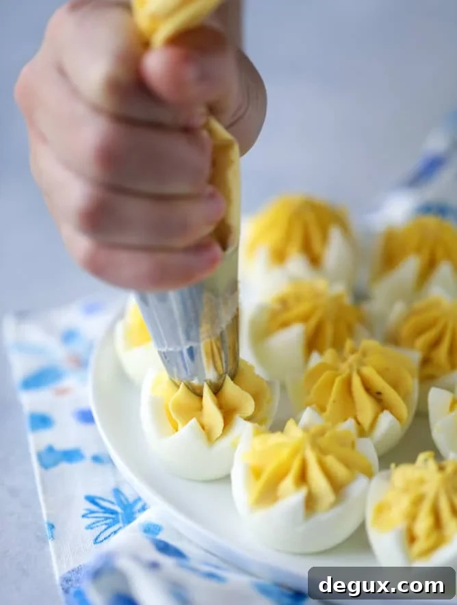 Toasted Sesame Sriracha Deviled Eggs Recipe 4 toasted sesame sriracha deviled eggs I howsweeteats.com