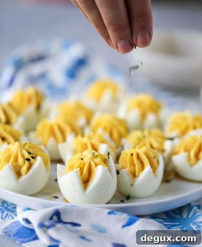 Toasted Sesame Sriracha Deviled Eggs Recipe 6 toasted sesame sriracha deviled eggs I howsweeteats.com