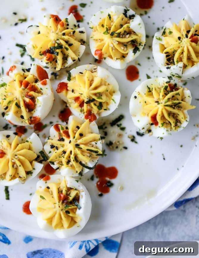 Toasted Sesame Sriracha Deviled Eggs Recipe 9 toasted sesame sriracha deviled eggs I howsweeteats.com