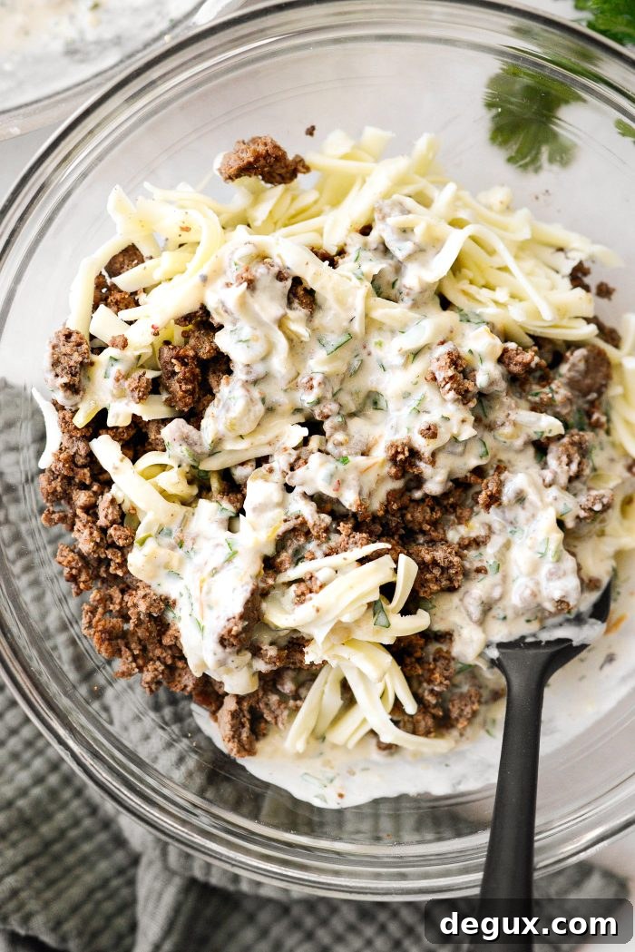Cheesy Beef Enchiladas with Salsa Verde Recipe 11 to the bowl with the ground beef add some cheese and sauce