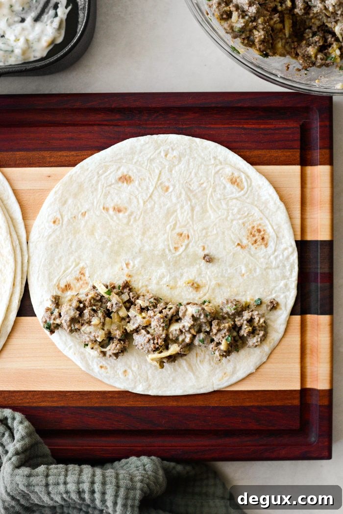 Cheesy Beef Enchiladas with Salsa Verde Recipe 12 add some filling to a soft flour tortilla
