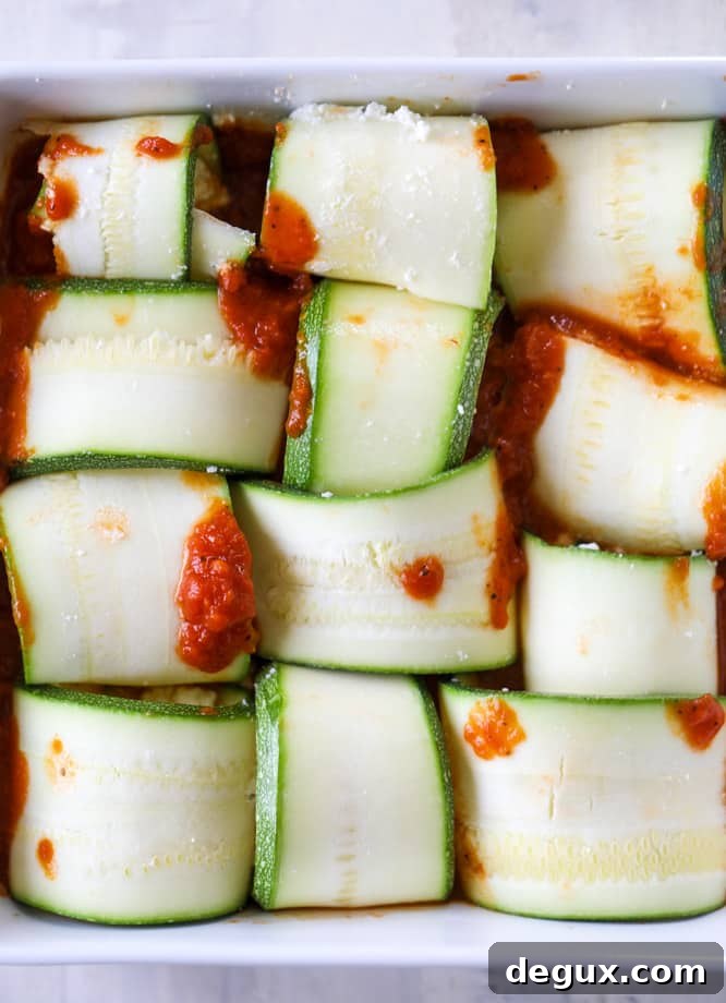 Cheesy Zucchini Roll-Ups (Video Guide) 3 cheesy zucchini roll-ups I howsweeteats.com