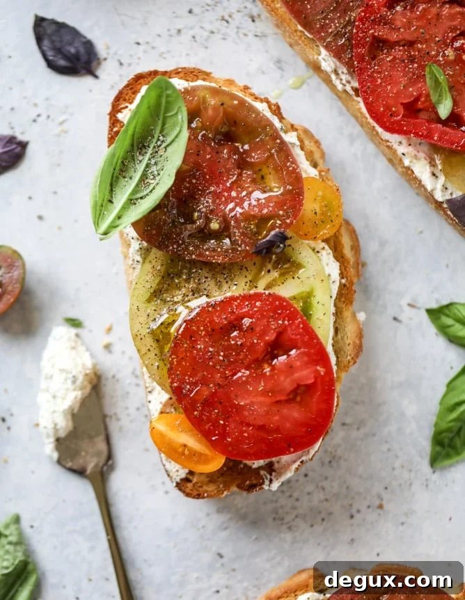 heirloom tomato garlic toast with basil whipped feta I howsweeteats.com
