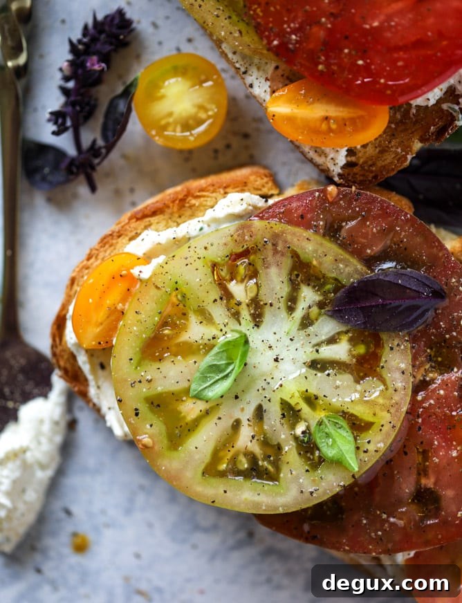 heirloom tomato garlic toast with basil whipped feta I howsweeteats.com