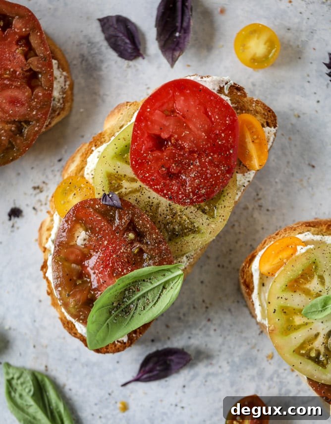 heirloom tomato garlic toast with basil whipped feta I howsweeteats.com