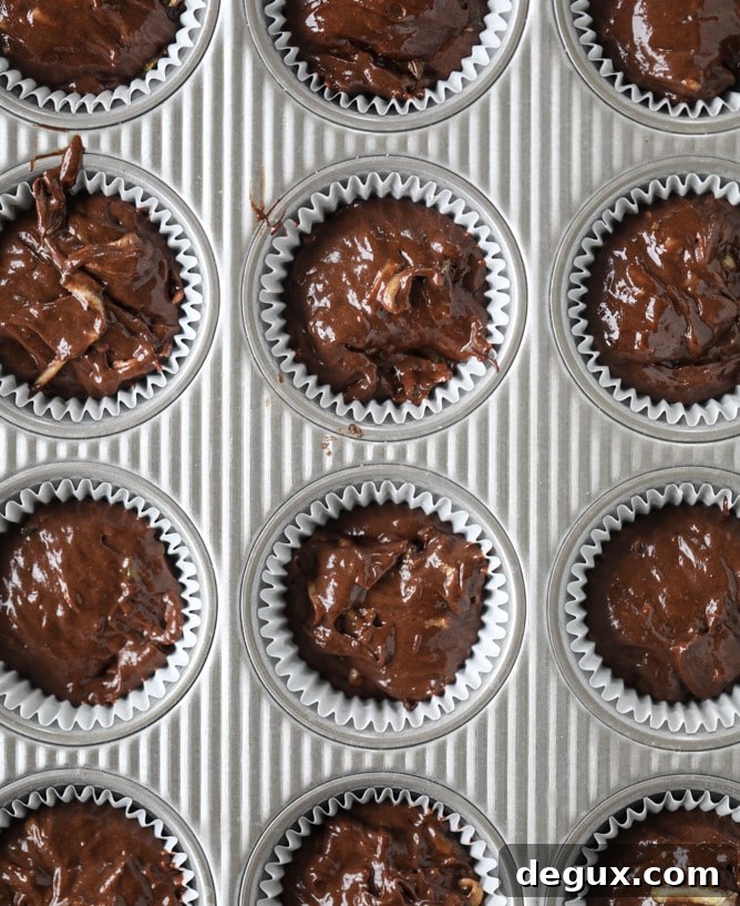 Chocolate Zucchini Cupcakes with Creamy Avocado Fudge Frosting 4 chocolate zucchini cupcakes with avocado frosting I howsweeteats.com
