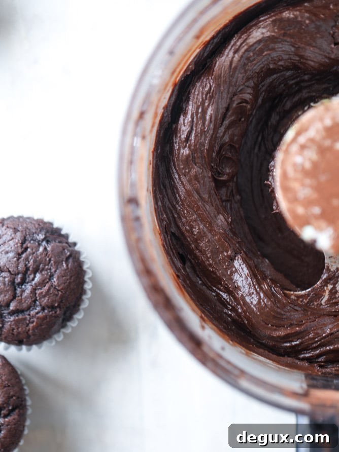 Chocolate Zucchini Cupcakes with Creamy Avocado Fudge Frosting 6 chocolate zucchini cupcakes with avocado frosting I howsweeteats.com