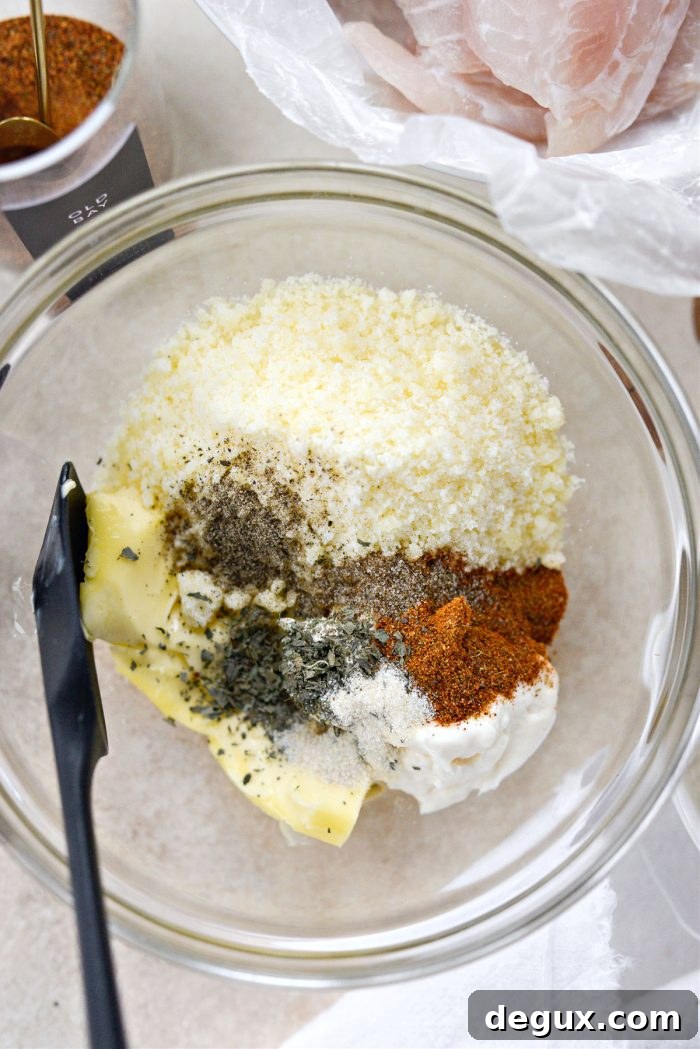 Add butter, mayo, parmesan, dried herbs and spices in a bowl.