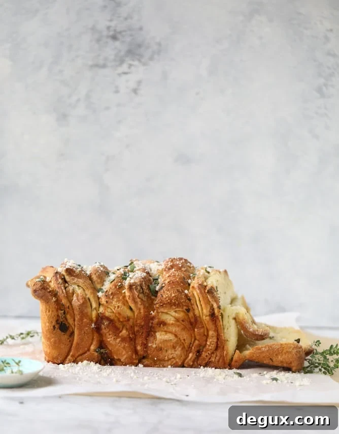 roasted garlic parmesan herb pull-apart bread I howsweeteats.com
