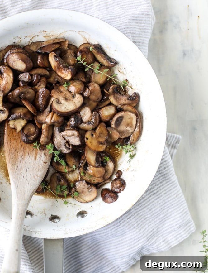 smothered skillet chicken with thyme butter mushrooms I howsweeteats.com
