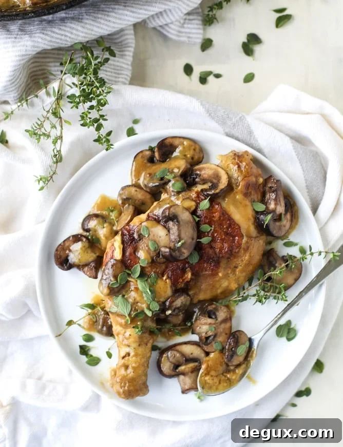 smothered skillet chicken with thyme butter mushrooms I howsweeteats.com