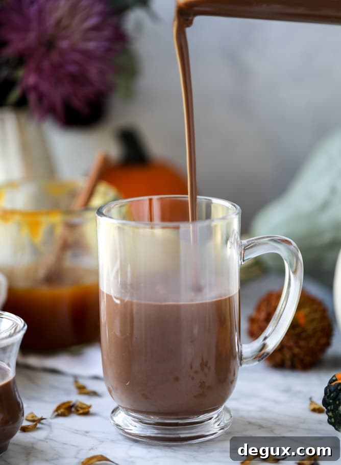 Pumpkin Coconut Hot Chocolate Recipe for Cozy Fall Nights 3 pumpkin coconut hot chocolate I howsweeteats.com #pumpkin #hotchocolate #drinks