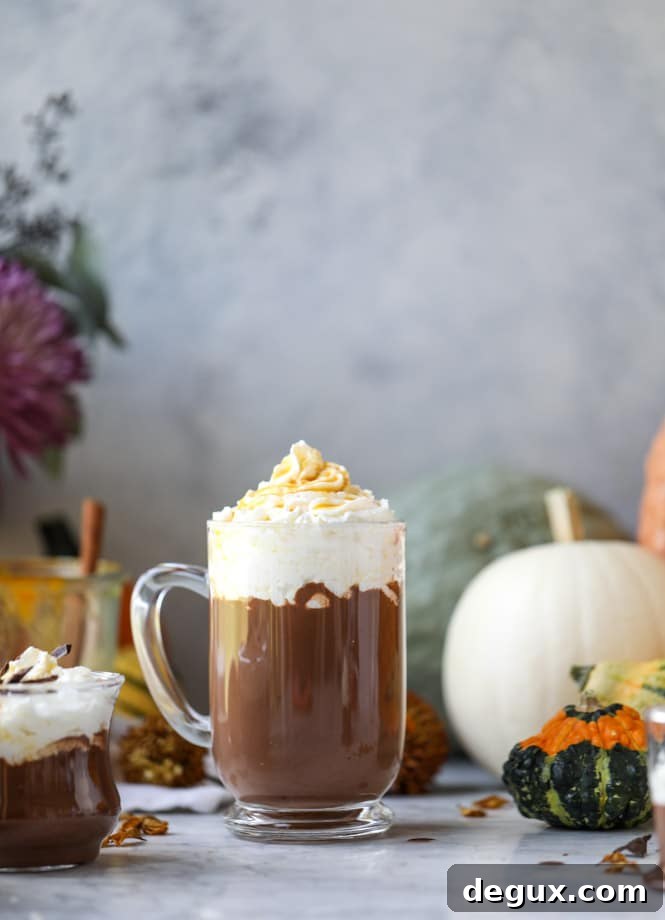 Pumpkin Coconut Hot Chocolate Recipe for Cozy Fall Nights 6 pumpkin coconut hot chocolate I howsweeteats.com #pumpkin #hotchocolate #drinks