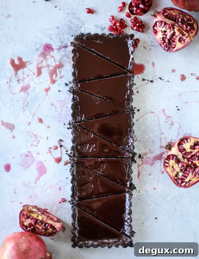 dark chocolate fudge pomegranate tart I howsweeteats.com #chocolate #pomegranate #dessert