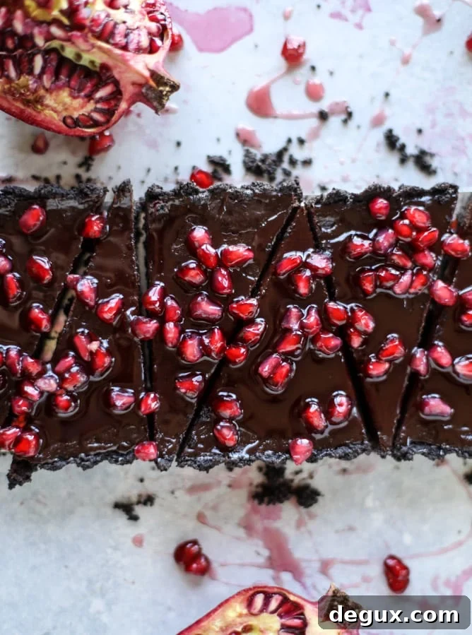 dark chocolate fudge pomegranate tart I howsweeteats.com #chocolate #pomegranate #dessert