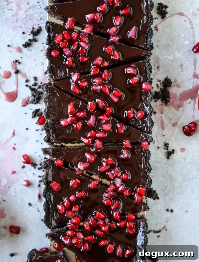 dark chocolate fudge pomegranate tart I howsweeteats.com #chocolate #pomegranate #dessert
