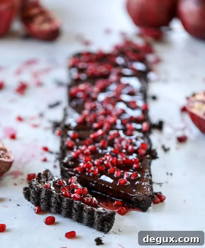 dark chocolate fudge pomegranate tart I howsweeteats.com #chocolate #pomegranate #dessert