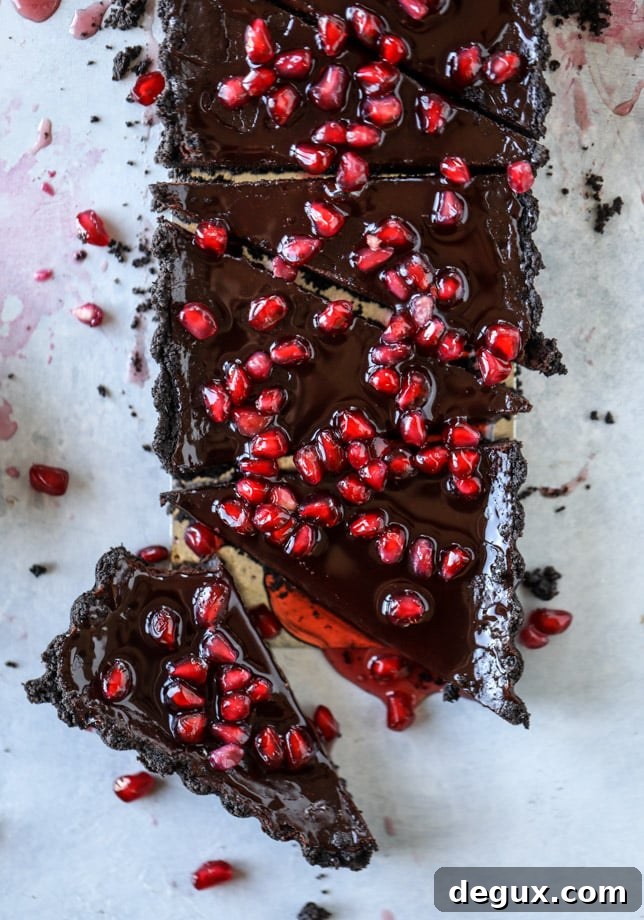dark chocolate fudge pomegranate tart I howsweeteats.com #chocolate #pomegranate #dessert