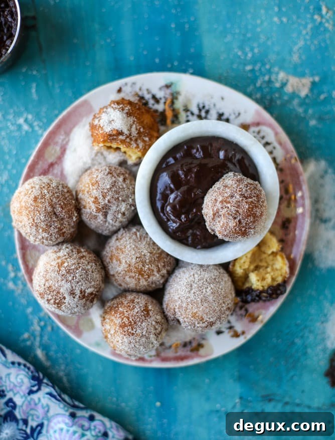 Pumpkin Cider Doughnut Holes Drizzled with Hot Fudge 3 pumpkin doughnut holes with hot fudge I howsweeteats.com