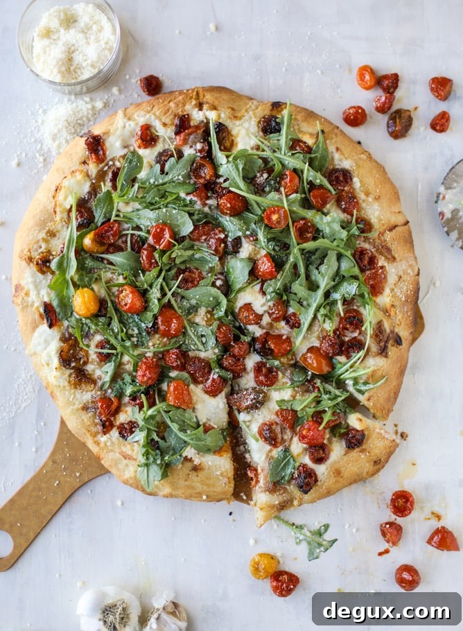 Slow-Roasted Cherry Tomato Pizza with Garlic Cream and Arugula 2 slow roasted cherry tomato pizza with garlic cream and arugula I howsweeteats.com #pizza #recipes