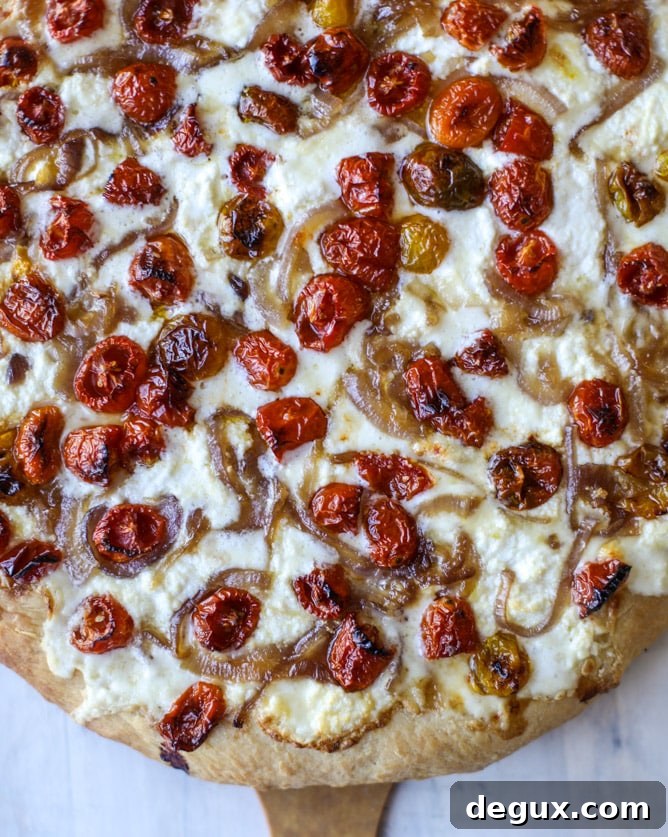 Slow-Roasted Cherry Tomato Pizza with Garlic Cream and Arugula 11 slow roasted cherry tomato pizza with garlic cream and arugula I howsweeteats.com #pizza #recipes