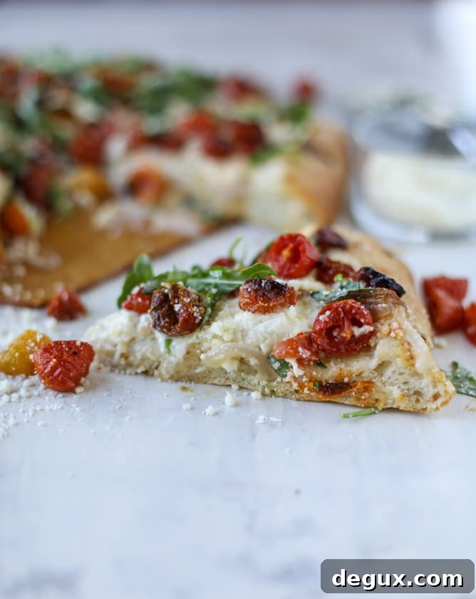 Slow-Roasted Cherry Tomato Pizza with Garlic Cream and Arugula 13 slow roasted cherry tomato pizza with garlic cream and arugula I howsweeteats.com #pizza #recipes