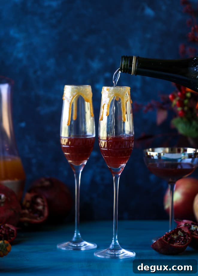 pomegranate cider mimosas with a salted caramel rim I howsweeteats.com #cocktails #thanksgiving #applecider #mimosas
