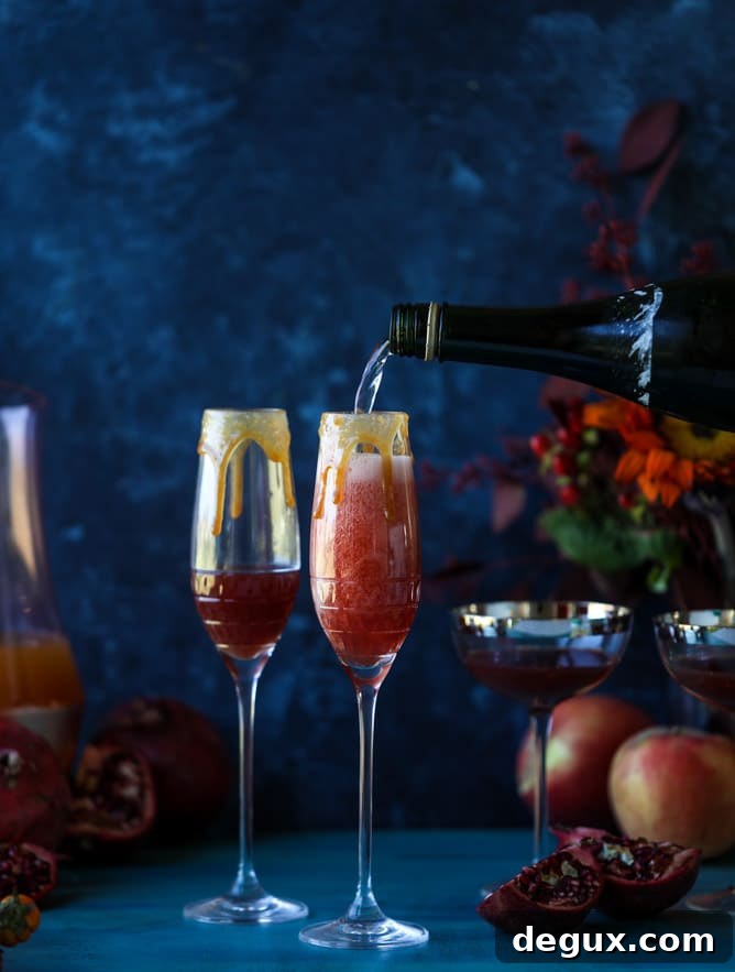 pomegranate cider mimosas with a salted caramel rim I howsweeteats.com #cocktails #thanksgiving #applecider #mimosas