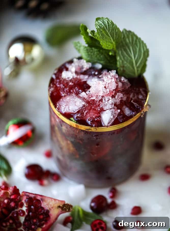 Pomegranate Cranberry Mint Julep Recipe for Festive Cocktails 11 cranberry pomegranate juleps I howsweeteats.com #cocktails #christmas #cranberry #pomegranate #mintjulep