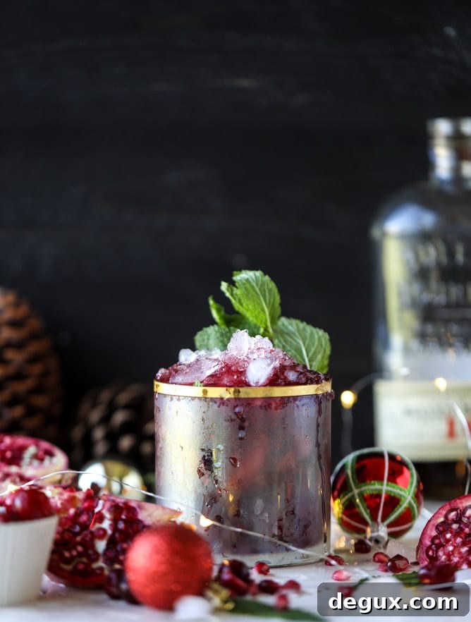 Pomegranate Cranberry Mint Julep Recipe for Festive Cocktails 3 cranberry pomegranate juleps I howsweeteats.com #cocktails #christmas #cranberry #pomegranate #mintjulep
