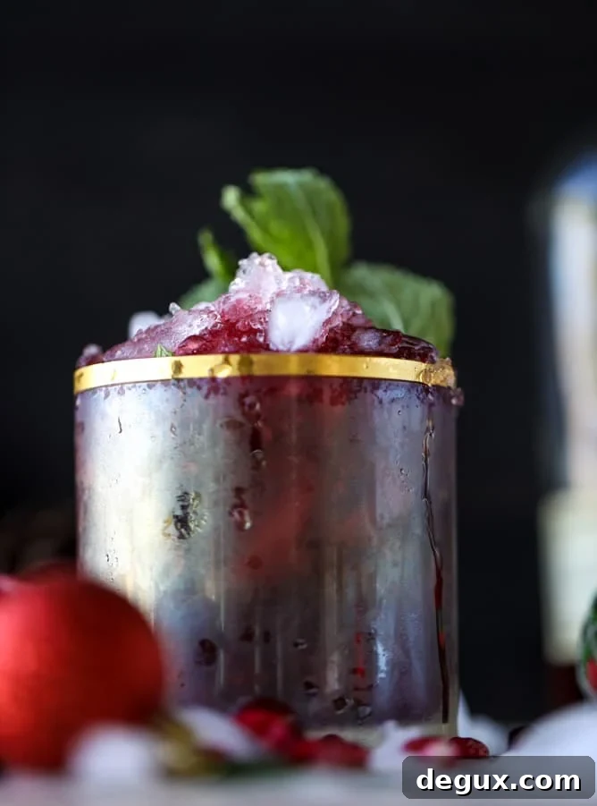 Pomegranate Cranberry Mint Julep Recipe for Festive Cocktails 4 cranberry pomegranate juleps I howsweeteats.com #cocktails #christmas #cranberry #pomegranate #mintjulep