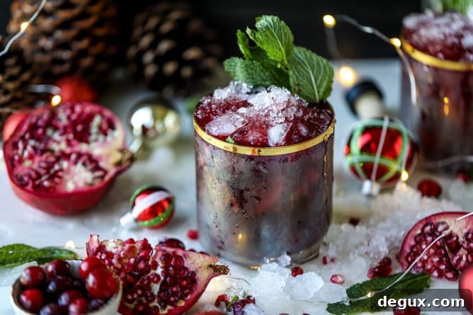 Pomegranate Cranberry Mint Julep Recipe for Festive Cocktails 6 cranberry pomegranate juleps I howsweeteats.com #cocktails #christmas #cranberry #pomegranate #mintjulep