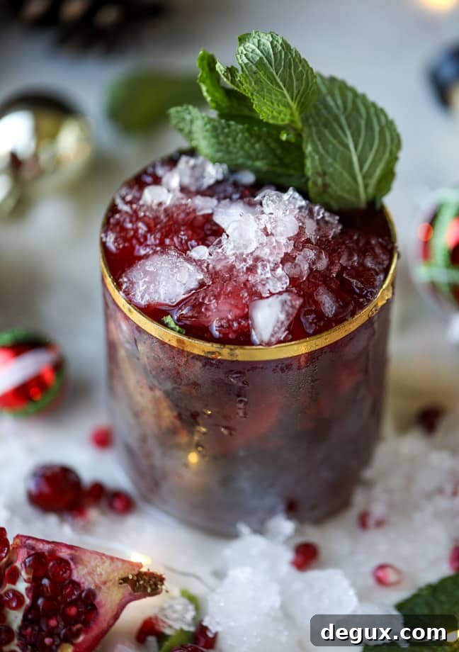 Pomegranate Cranberry Mint Julep Recipe for Festive Cocktails 7 cranberry pomegranate juleps I howsweeteats.com #cocktails #christmas #cranberry #pomegranate #mintjulep