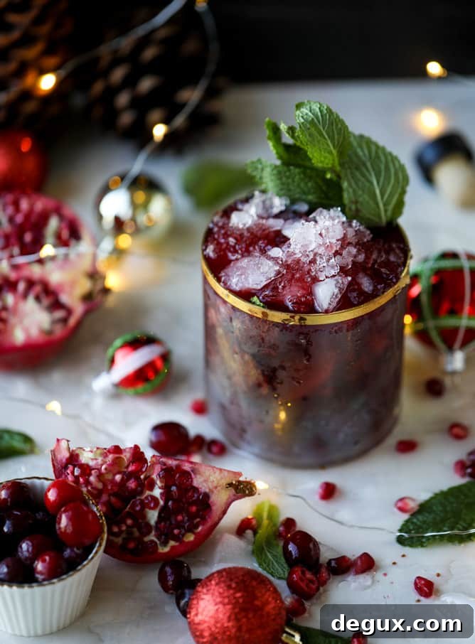 Pomegranate Cranberry Mint Julep Recipe for Festive Cocktails 8 cranberry pomegranate juleps I howsweeteats.com #cocktails #christmas #cranberry #pomegranate #mintjulep