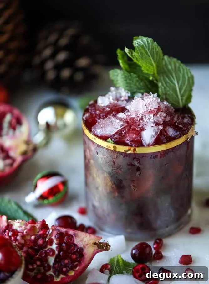 Pomegranate Cranberry Mint Julep Recipe for Festive Cocktails 9 cranberry pomegranate juleps I howsweeteats.com #cocktails #christmas #cranberry #pomegranate #mintjulep
