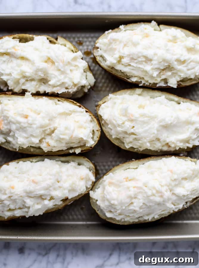 Creamy Greek Yogurt Twice-Baked Potatoes with Chives 4 greek yogurt twice baked potatoes I howsweeteats.com #potatoes #twicebaked #sidedish #christmas #holiday