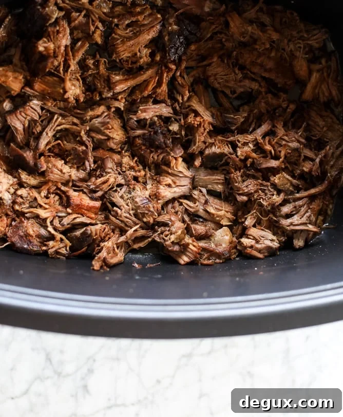 slow cooker shredded beef enchiladas I howsweeteats.com #beef #enchiladas #slowcooker
