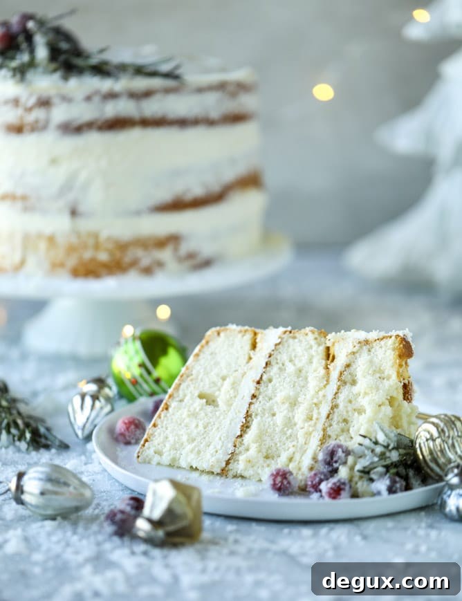 Winter White Sparkle Cake: Festive Snowflake Dessert Recipe 10 white christmas sparkle cake I howsweeteats.com #christmas #cake #vanilla #almond