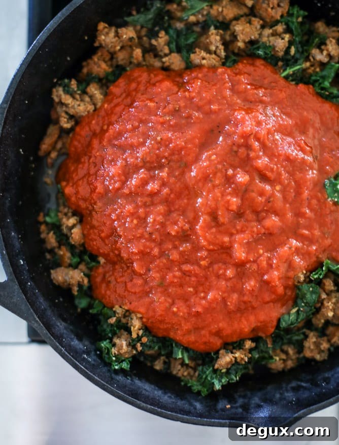 spicy sausage and kale skillet lasagna I howsweeteats.com #sausage #kale #skillet #lasagna #pasta