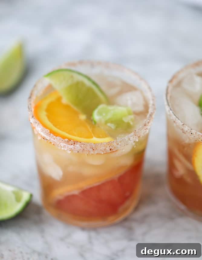 Triple Citrus Kombucha Fizz with Salty Chili Sugar Rim 4 kombucha mocktail - triple citrus kombucha fizz