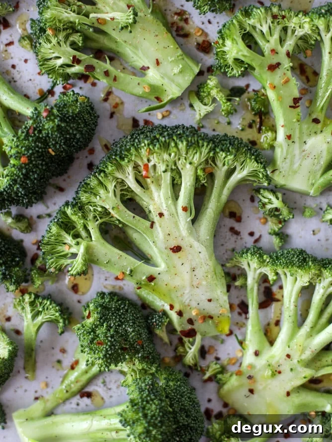 best roasted broccoli with goat cheese drizzle I howsweeteats.com #broccoli #roasted #goatcheese #spicy #lemon