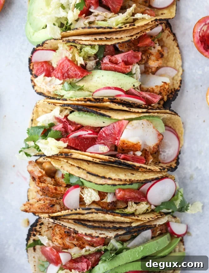 Cajun Fish Tacos with Zesty Blood Orange Slaw 11 cajun fish tacos with blood orange slaw I howsweeteats.com #fishtacos #tacos #bloodorange #fish