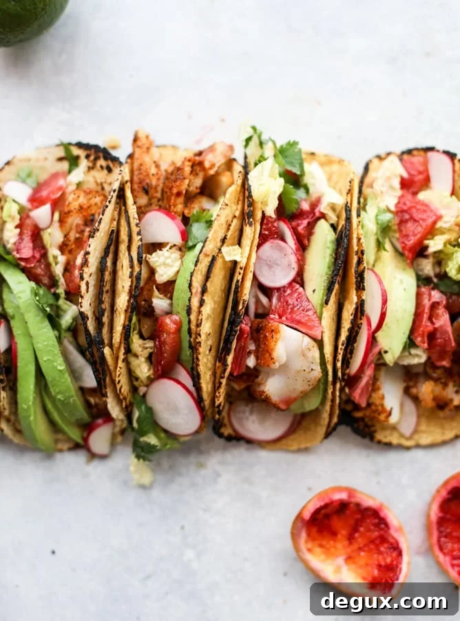 Cajun Fish Tacos with Zesty Blood Orange Slaw 8 cajun fish tacos with blood orange slaw I howsweeteats.com #fishtacos #tacos #bloodorange #fish